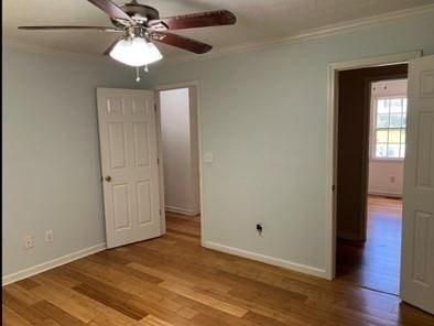 279 Fairview Dr, Dallas, GA 30157 - empty room with crown molding, ceiling fan, wood finished floors, and baseboards