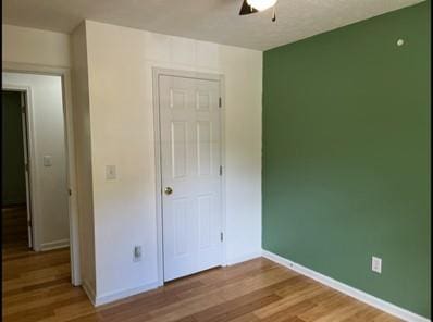 279 Fairview Dr, Dallas, GA 30157 - unfurnished bedroom with light wood-style flooring, baseboards, and a ceiling fan