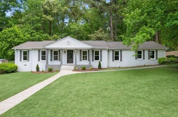 ranch-style house with a front lawn