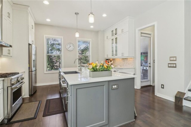 823 Canterbury Overlook, Atlanta, GA 30324 - kitchen featuring a center island with sink, dark wood-style flooring, a sink, and appliances with stainless steel finishes