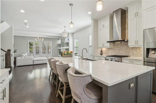 823 Canterbury Overlook, Atlanta, GA 30324 - kitchen with range, stainless steel refrigerator with ice dispenser, dark wood-type flooring, wall chimney exhaust hood, and a sink
