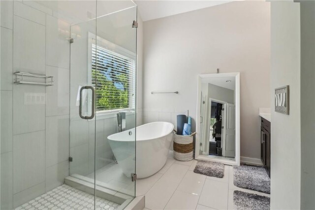 823 Canterbury Overlook, Atlanta, GA 30324 - bathroom with a stall shower, a soaking tub, vanity, and tile patterned flooring