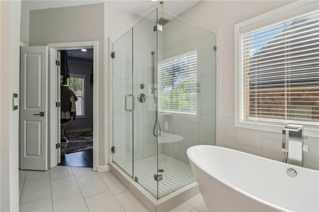 823 Canterbury Overlook, Atlanta, GA 30324 - full bathroom featuring a stall shower, a freestanding tub, and tile patterned flooring