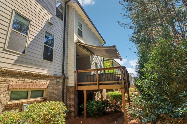 823 Canterbury Overlook, Atlanta, GA 30324 - view of side of home with a wooden deck and brick siding