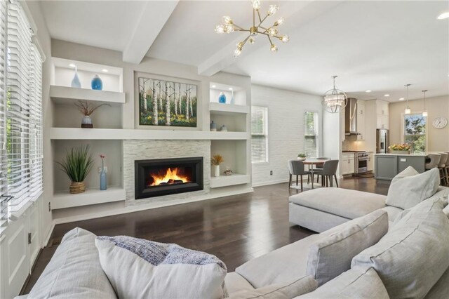 823 Canterbury Overlook, Atlanta, GA 30324 - living area featuring a stone fireplace, recessed lighting, a chandelier, and dark wood finished floors