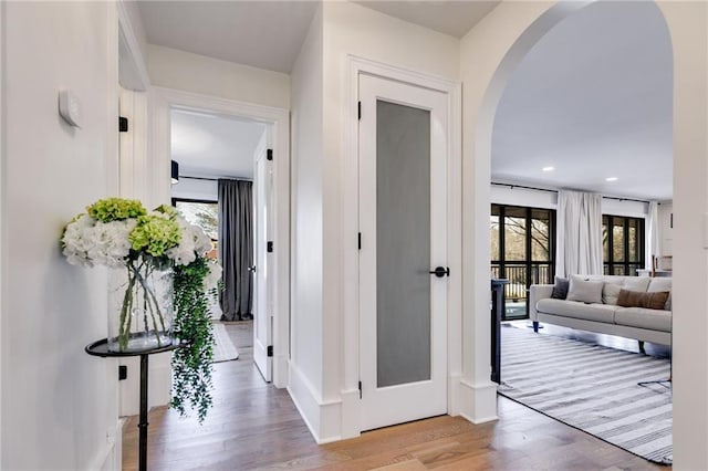 hall with light hardwood / wood-style floors