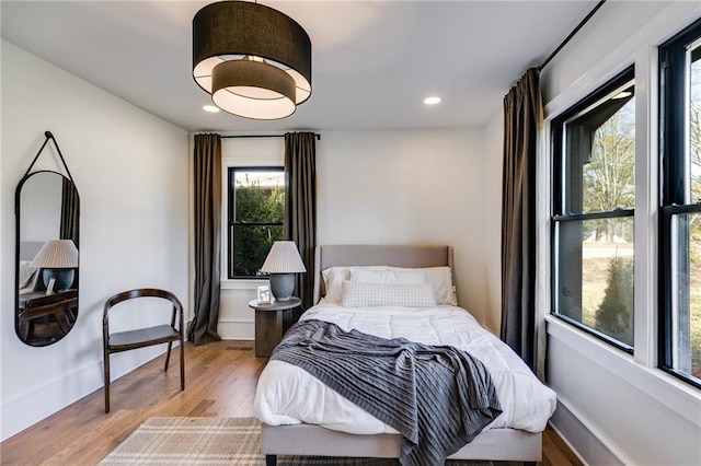 bedroom with light hardwood / wood-style floors