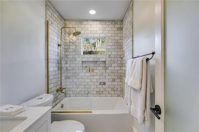 full bathroom featuring vanity, toilet, and tiled shower / bath combo