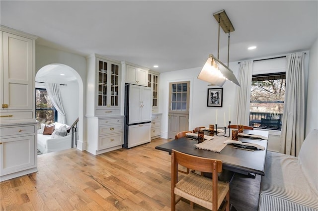 dining area featuring light wood-type flooring