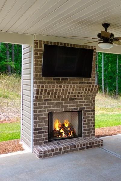 view of patio / terrace with an outdoor brick fireplace