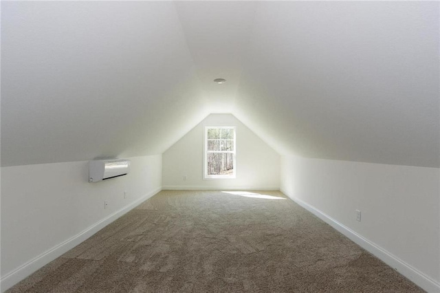 bonus room featuring vaulted ceiling, carpet flooring, and a wall mounted air conditioner