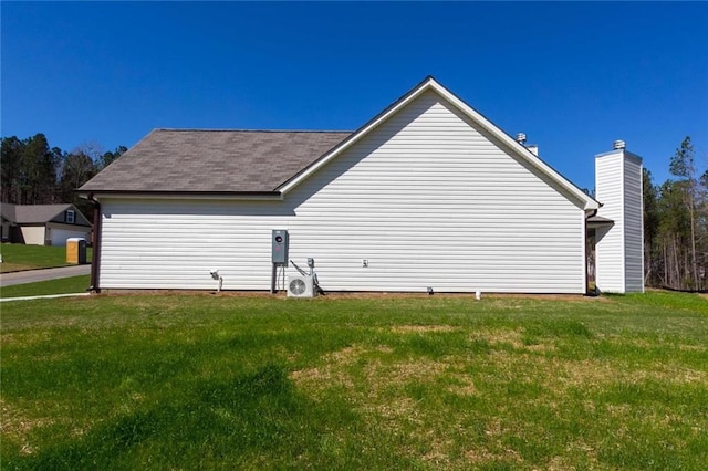 view of home's exterior with a lawn