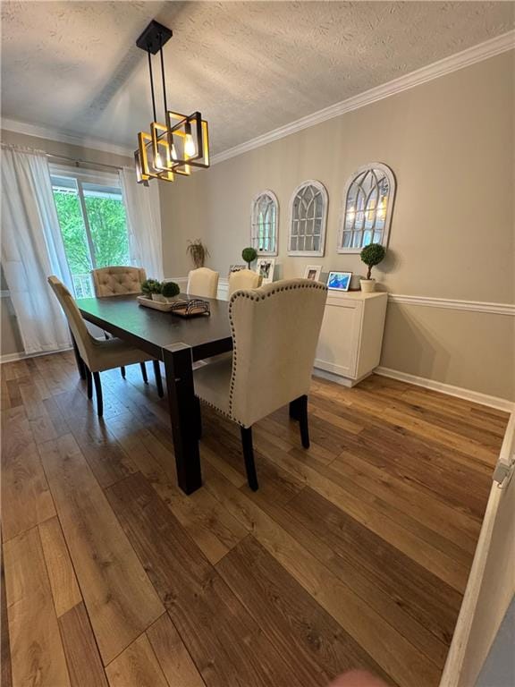 190 Grayland Creek Dr, Lawrenceville, GA 30046 - dining room featuring a textured ceiling, a chandelier, hardwood / wood-style floors, crown molding, and baseboards