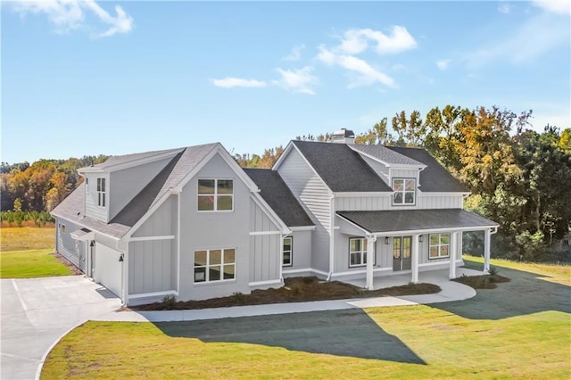 view of front of home with a porch and a front lawn