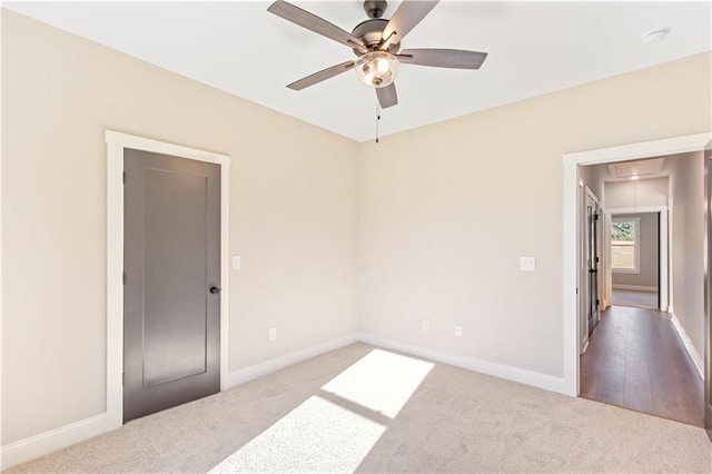 unfurnished room with ceiling fan and light hardwood / wood-style flooring