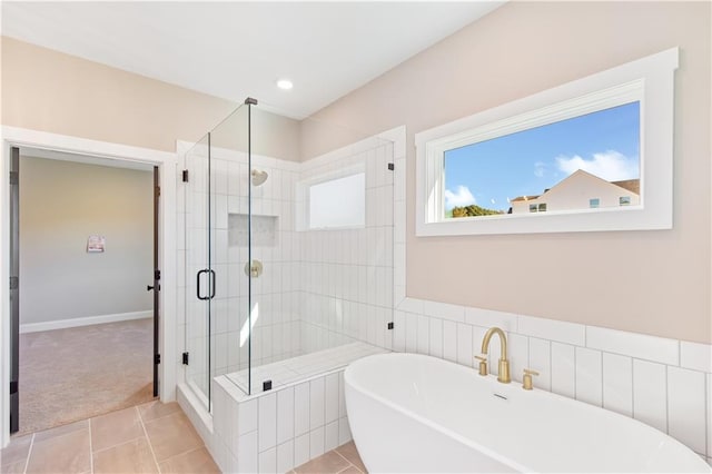 bathroom with tile patterned floors and plus walk in shower