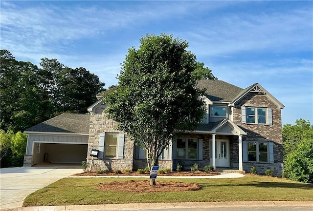 4010 Sierra Knolls Ct, Cumming, GA 30040 - craftsman inspired home featuring stone siding, driveway, an attached garage, a front yard, and a shingled roof