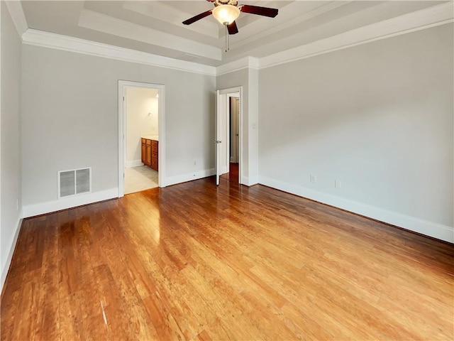 6405 Beaver Creek Trl, Atlanta, GA 30349 - spare room with light wood-style flooring, a ceiling fan, baseboards, a tray ceiling, and visible vents