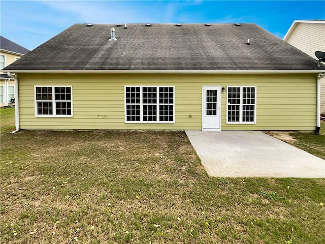 6405 Beaver Creek Trl, Atlanta, GA 30349 - rear view of property with a patio, a lawn, and roof with shingles