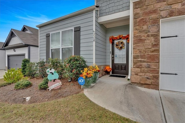 property entrance with a garage