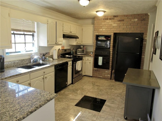 kitchen with a textured ceiling, under cabinet range hood, a sink, white cabinets, and black appliances