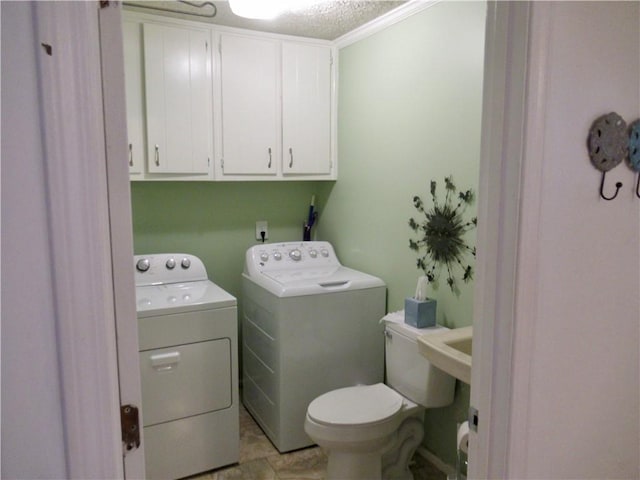 washroom with laundry area and washing machine and dryer