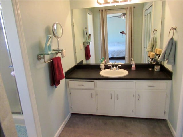 ensuite bathroom with vanity, baseboards, and ensuite bathroom