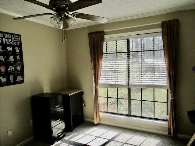 bedroom with light carpet, baseboards, a ceiling fan, ornamental molding, and a textured ceiling