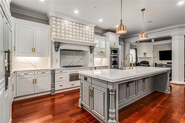 kitchen with white cabinetry, ornamental molding, appliances with stainless steel finishes, gray cabinets, and a warming drawer