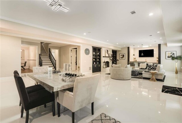 living room with baseboards and recessed lighting