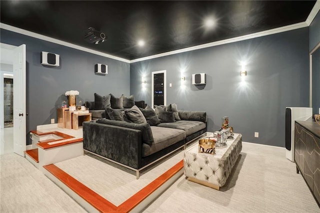 carpeted cinema room featuring ornamental molding