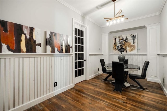 dining room with ornamental molding and wood finished floors