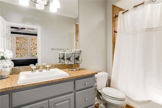 full bath with curtained shower, toilet, ornamental molding, ceiling fan, and vanity