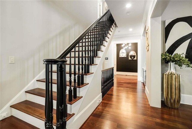 bedroom featuring lofted ceiling, carpet floors, visible vents, baseboards, and ornamental molding