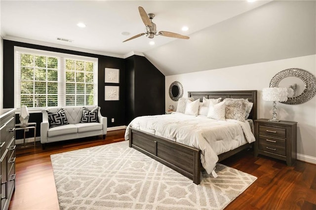 bedroom featuring lofted ceiling, dark wood-style flooring, a ceiling fan, visible vents, and baseboards