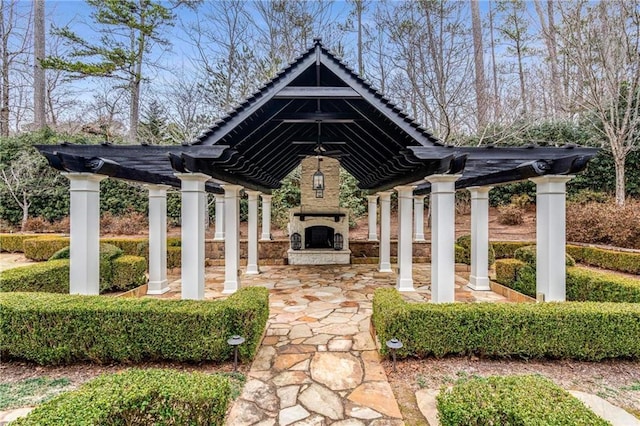 view of property's community with a patio and a pergola