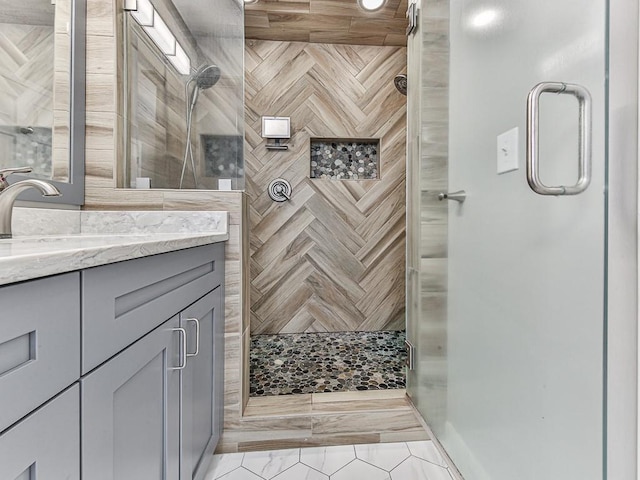 bathroom with vanity and walk in shower