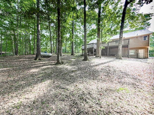 view of yard with a wooden deck