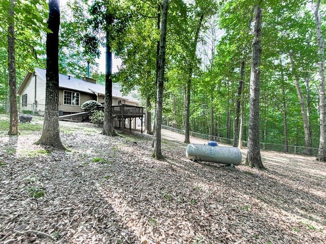 view of yard featuring a wooden deck