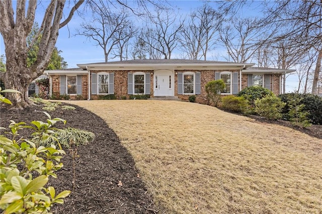 ranch-style house with brick siding