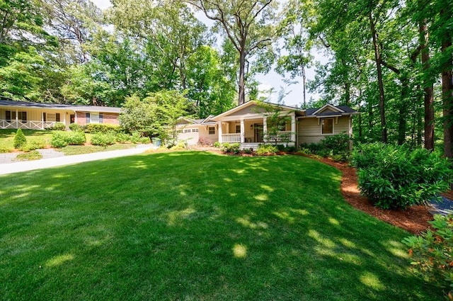 view of yard featuring covered porch