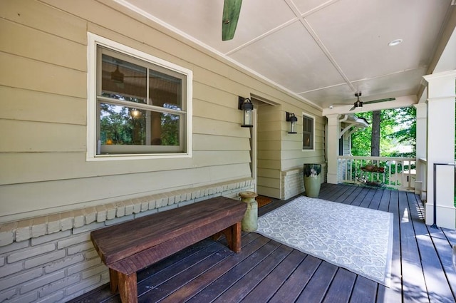 wooden deck with ceiling fan