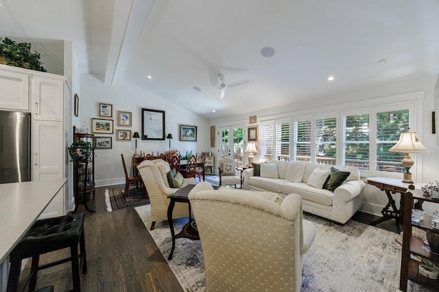 living room with ceiling fan, vaulted ceiling with beams, and hardwood / wood-style floors