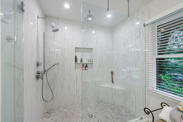 bathroom featuring tiled shower