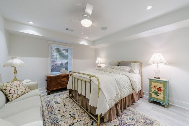 bedroom with ceiling fan and light hardwood / wood-style flooring