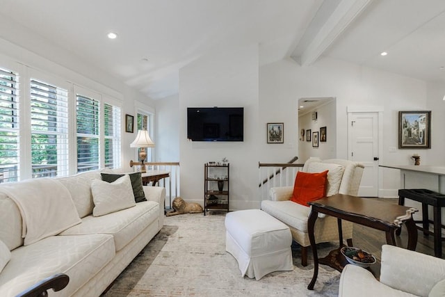 living room featuring vaulted ceiling with beams and hardwood / wood-style flooring