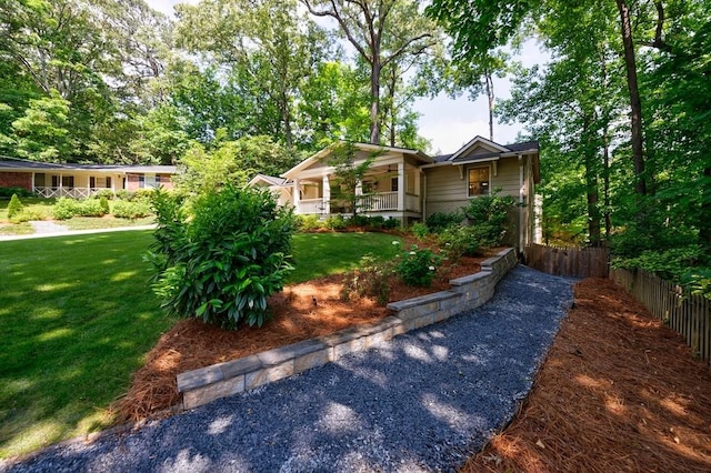 view of front facade featuring a front yard and a porch