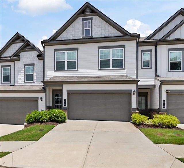 320 Crider Ct, Woodstock, GA 30188 - view of front of property featuring a garage, driveway, and board and batten siding