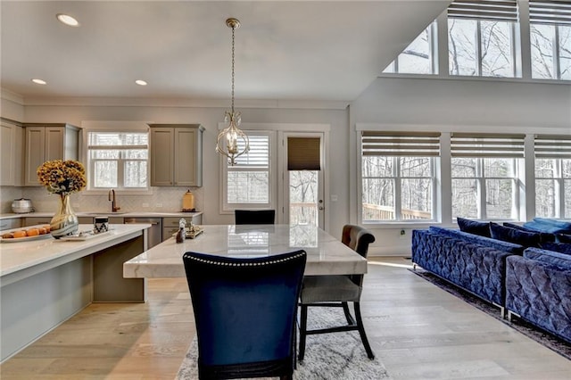 dining space with plenty of natural light and light hardwood / wood-style flooring