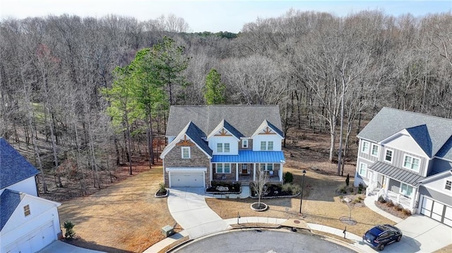 view of front of house featuring a porch and a garage